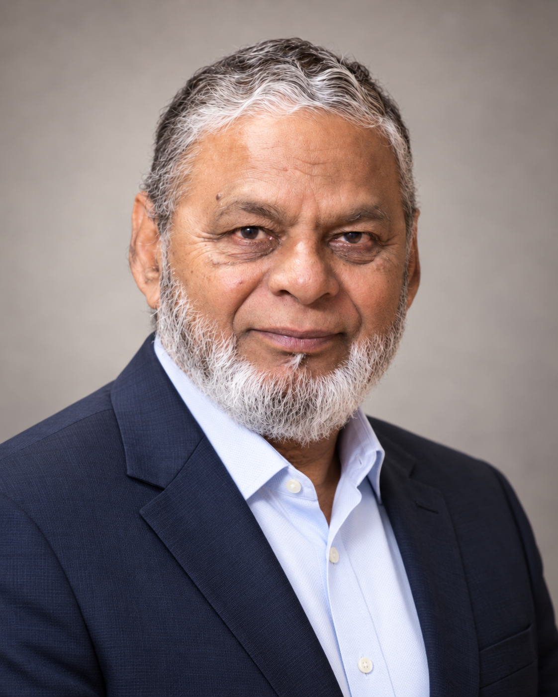 Portrait of Dr. Mohammad Muhiul Haque Siddiqui in a blue jacket